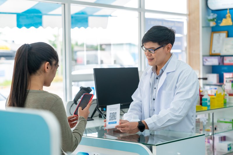 man offering modern payment solutions for patient