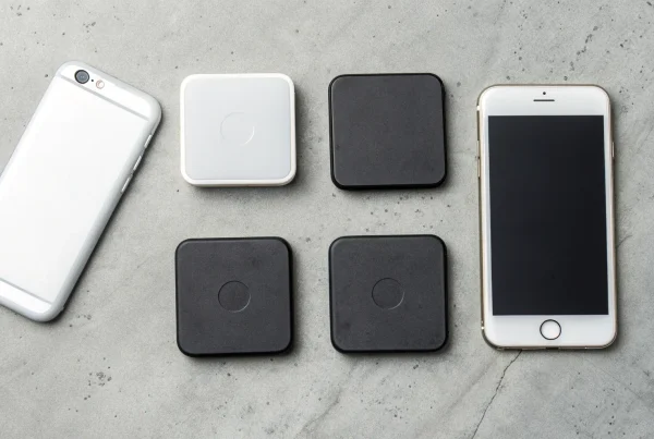 A variety of free mobile credit card readers displayed next to a smartphone.